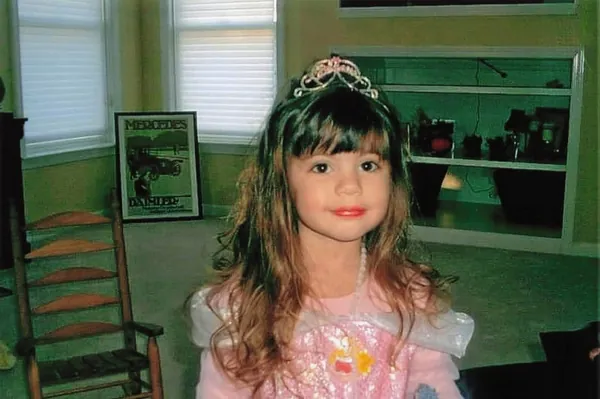 Jenna as a little girl wearing a tiara